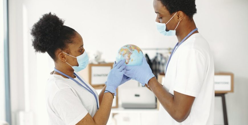 globe-hands-protective-mask-gloves-guy-girl-africans_1157-46652