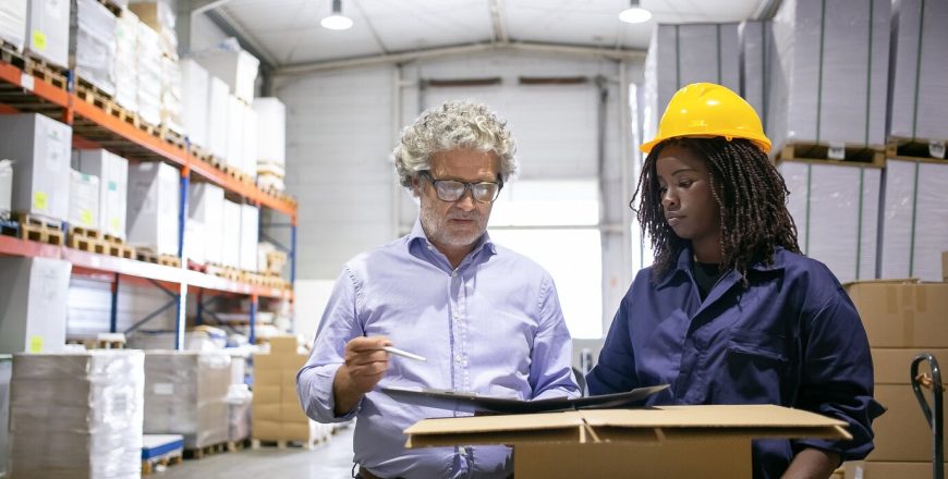 serious-mature-inspector-consulting-black-female-employee-his-checking-warehouse-completing-form-copy-space-front-view-labor-inspection-concept_74855-14266